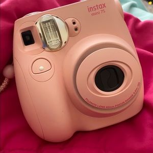 Baby pink Polaroid camera.